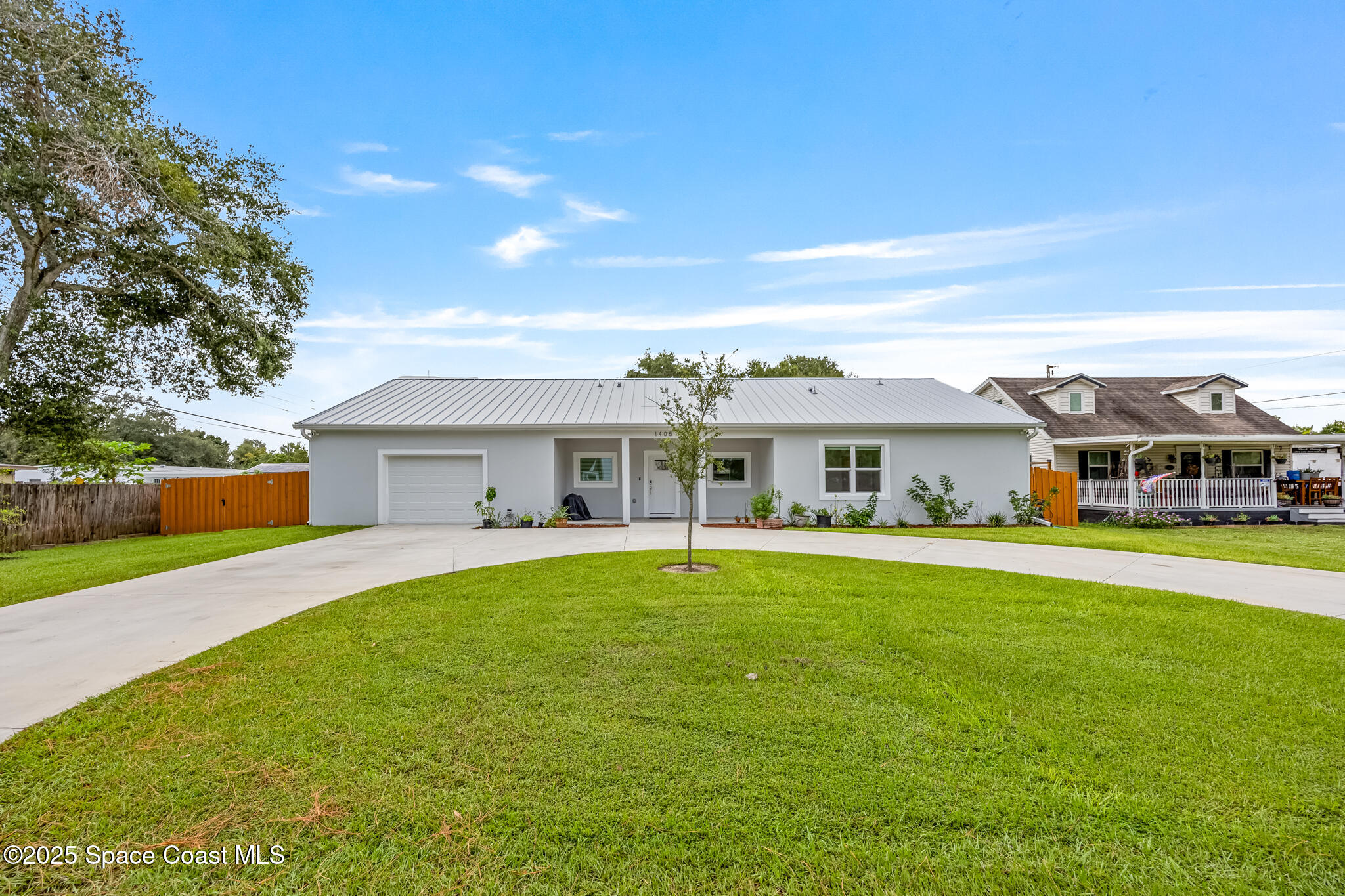 1405 Highland Court Cocoa, FL 32922 - Photo 1 of 29 a front view of a house with a garden