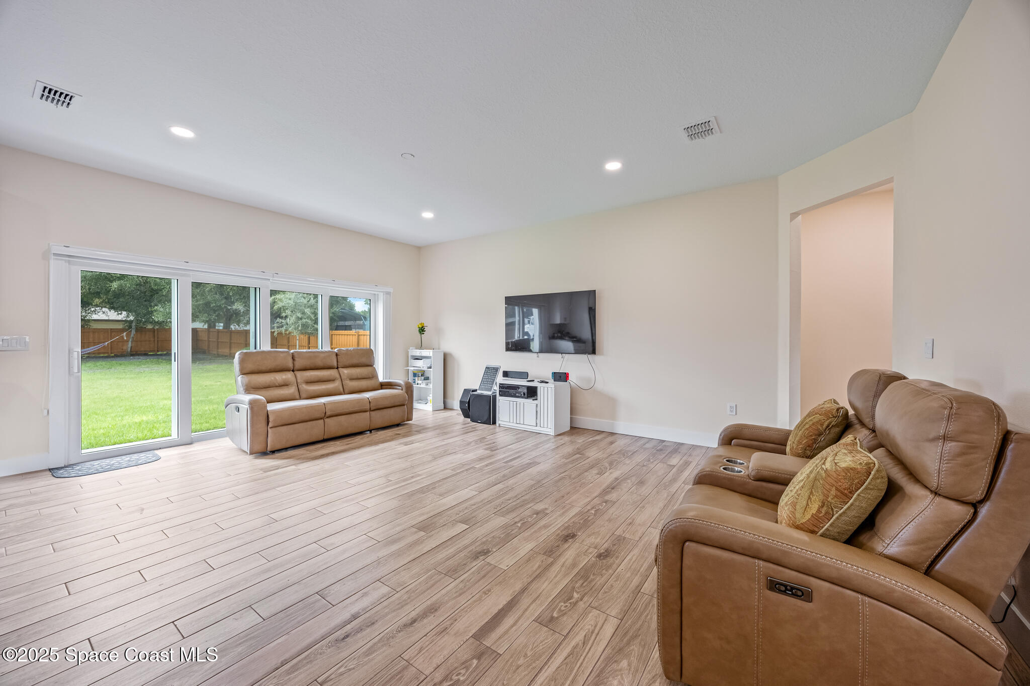 1405 Highland Court Cocoa, FL 32922 - Photo 11 of 29 a living room with furniture and a wooden floor
