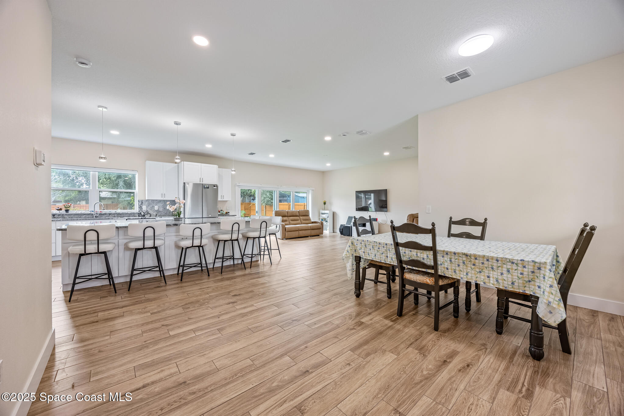 1405 Highland Court Cocoa, FL 32922 - Photo 12 of 29 a view of a dining room with furniture and wooden floor