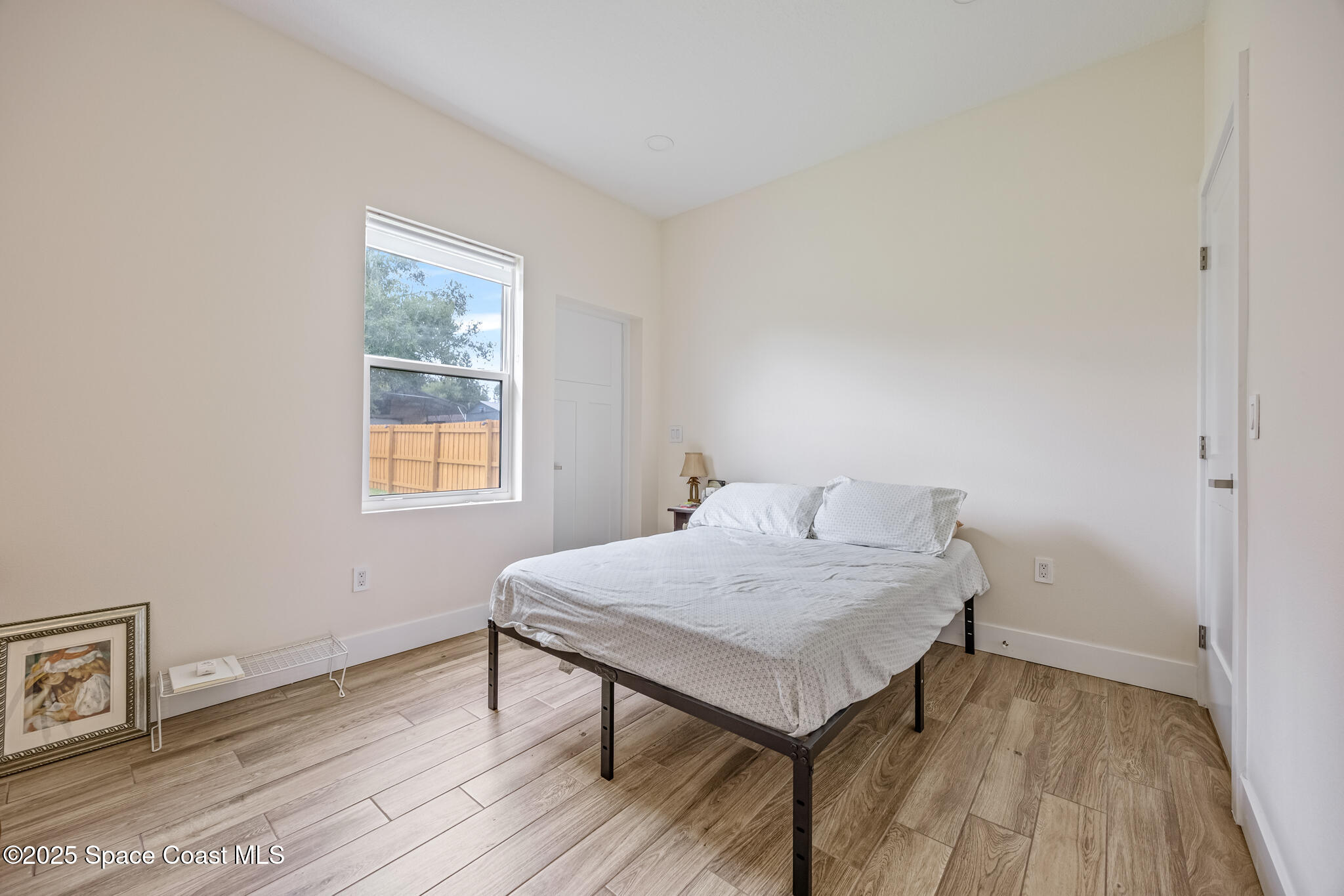 1405 Highland Court Cocoa, FL 32922 - Photo 22 of 29 a room with a table and a window