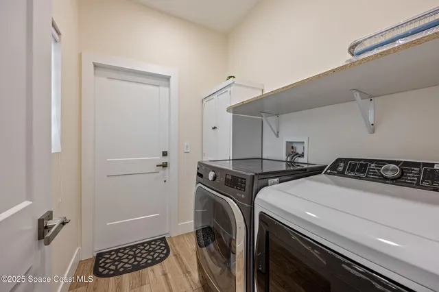 a utility room with dryer and washer