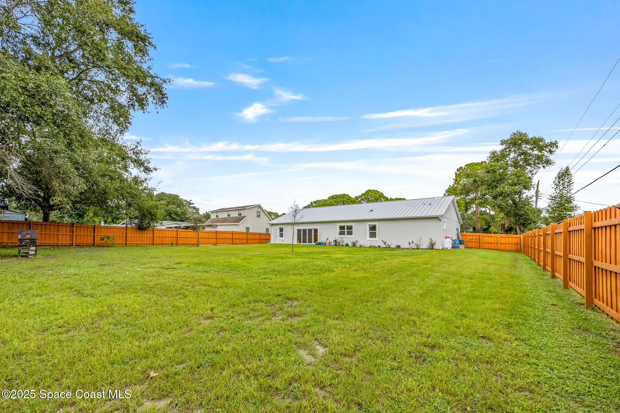 1405 Highland Court Cocoa, FL 32922 - Photo 25 of 29 a view of a house with a big yard