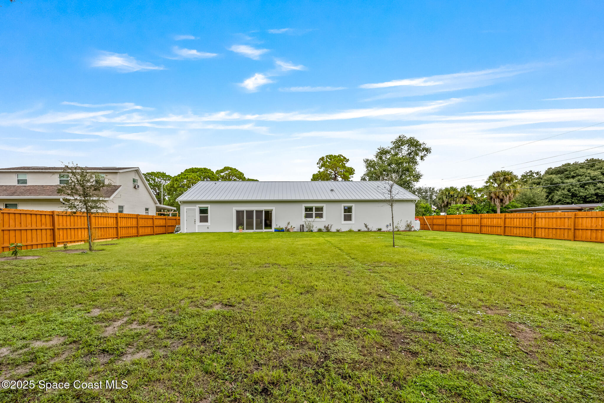 1405 Highland Court Cocoa, FL 32922 - Photo 26 of 29 a view of an house with backyard space and balcony