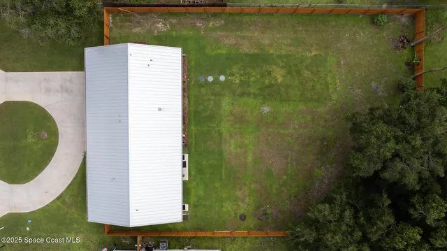 a view of a bathroom with a sink and mirror
