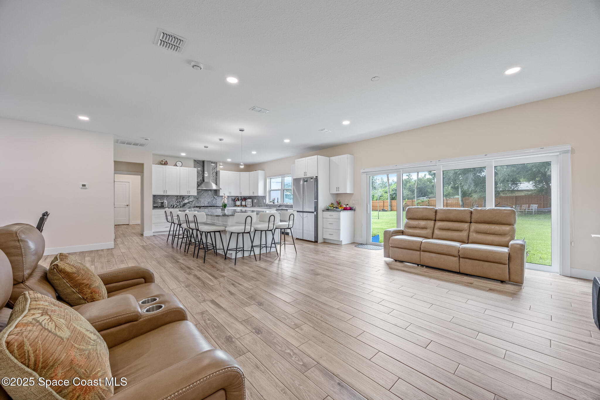 1405 Highland Court Cocoa, FL 32922 - Photo 4 of 29 a living room with furniture and wooden floor