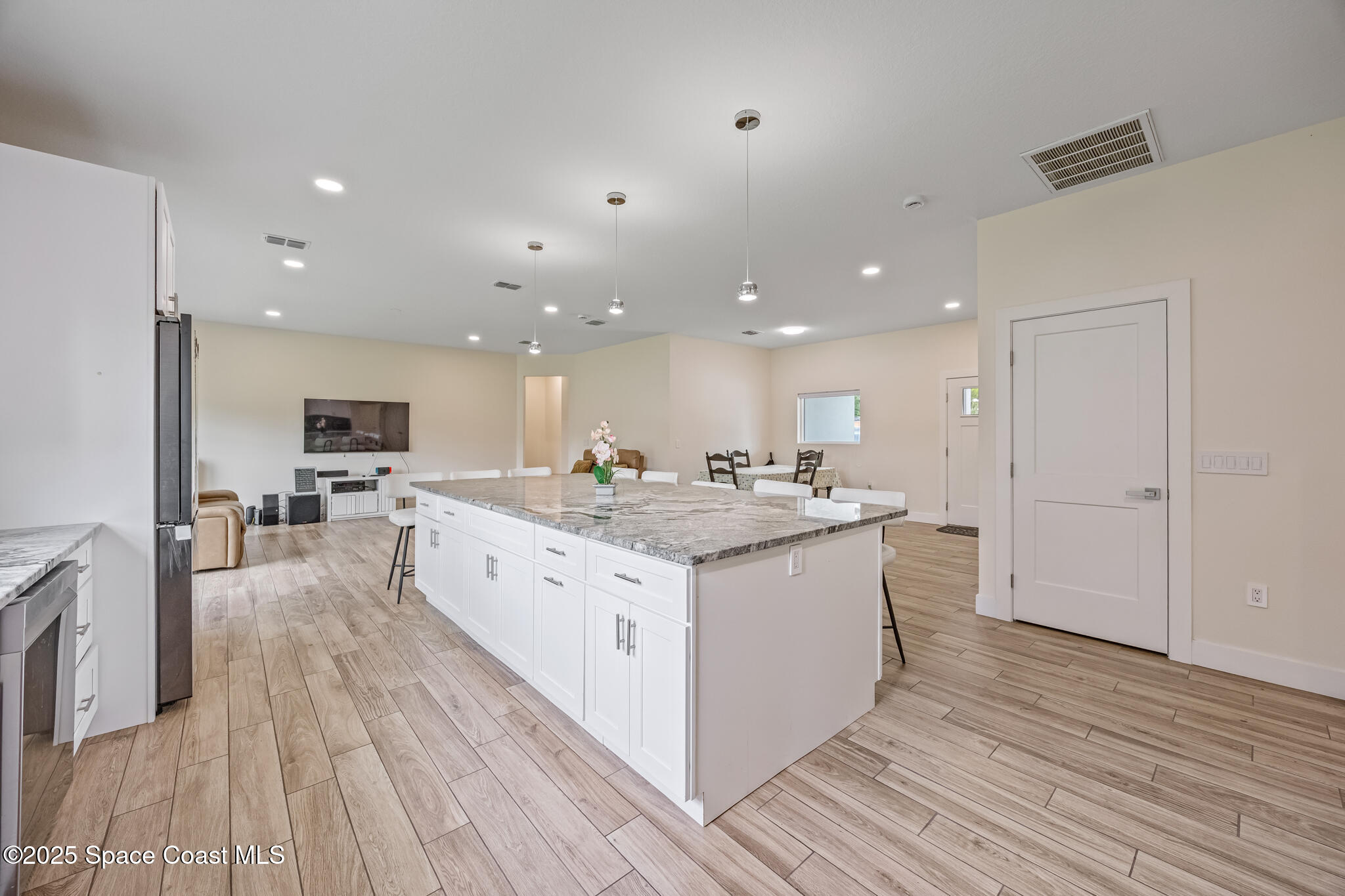 1405 Highland Court Cocoa, FL 32922 - Photo 9 of 29 a large kitchen with stainless steel appliances granite countertop a large counter top and oven