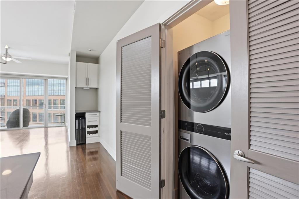 1100 Howell Mill Road Northwest, Unit 608 Atlanta, GA 30318 - Photo 15 of 37 a view of a hallway with washer and dryer