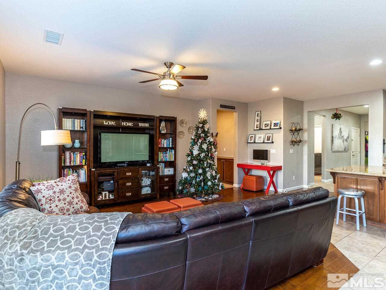 1925 Horse Prairie Road Reno, NV 89521 - Photo 11 of 32 a living room with furniture and a flat screen tv