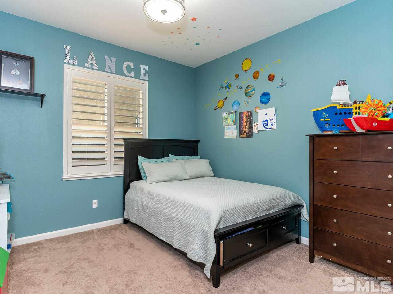 1925 Horse Prairie Road Reno, NV 89521 - Photo 17 of 32 a bedroom with a bed and a window