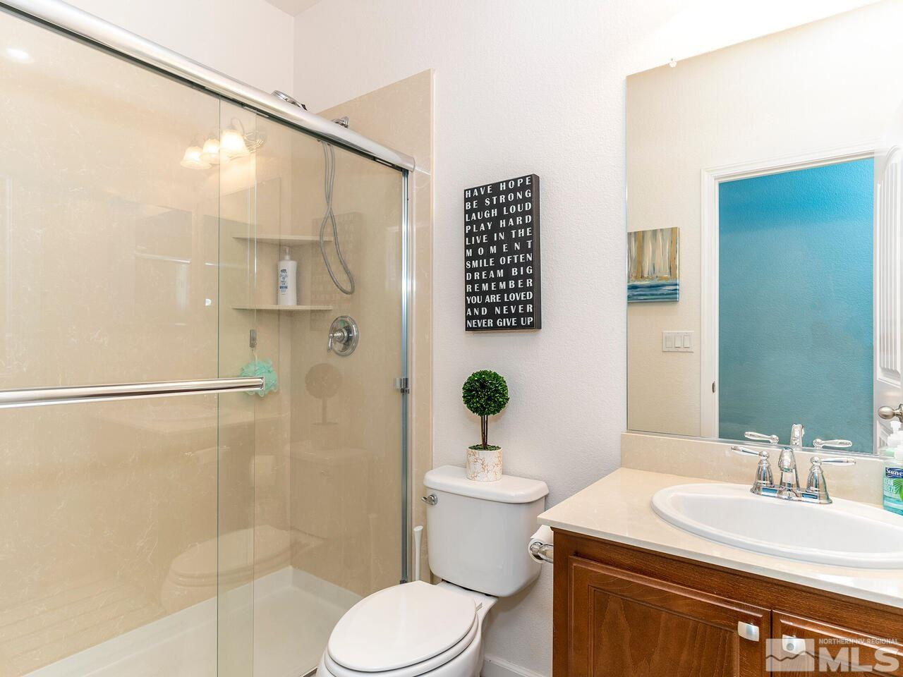 1925 Horse Prairie Road Reno, NV 89521 - Photo 18 of 32 a bathroom with a sink toilet and shower