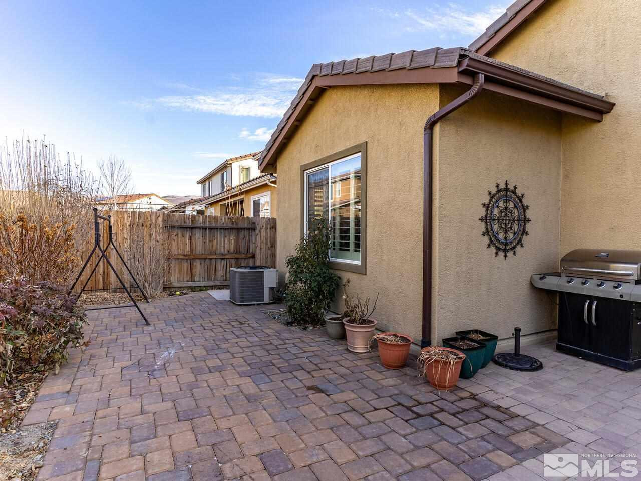 1925 Horse Prairie Road Reno, NV 89521 - Photo 25 of 32 a backyard of a house with sofas table and chairs