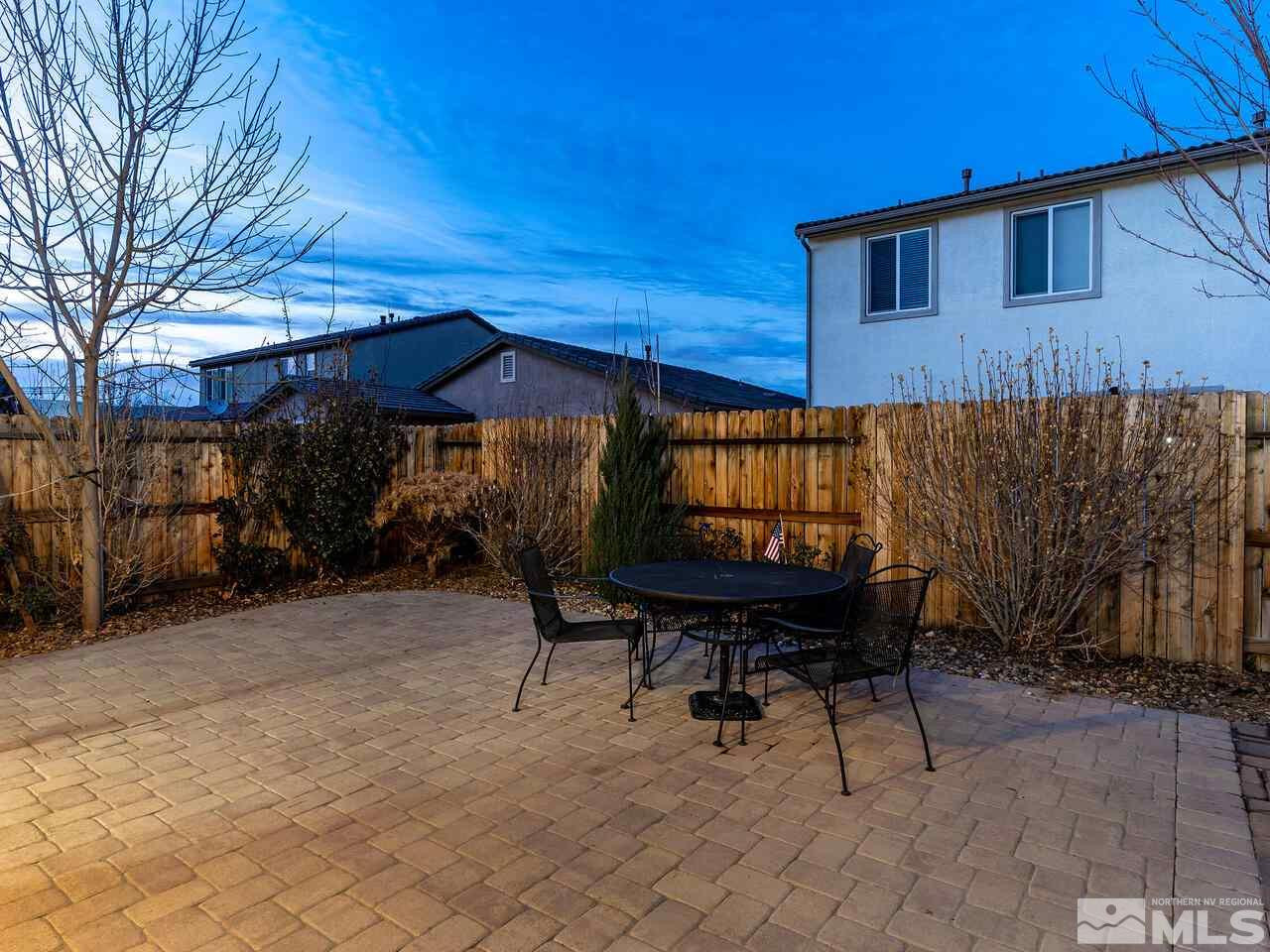 1925 Horse Prairie Road Reno, NV 89521 - Photo 32 of 32 a backyard of a house with table and chairs