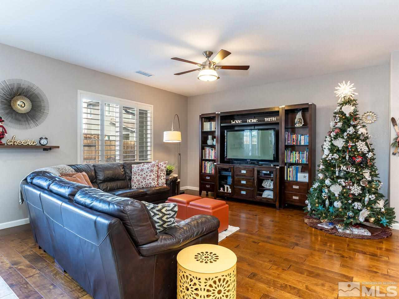 1925 Horse Prairie Road Reno, NV 89521 - Photo 10 of 32 a living room with furniture and a flat screen tv