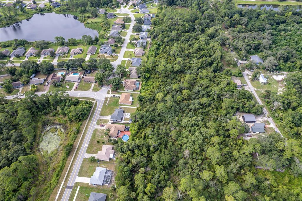 North Road Deltona, FL 32725 - Photo 13 of 13 an aerial view of residential houses with outdoor space and trees