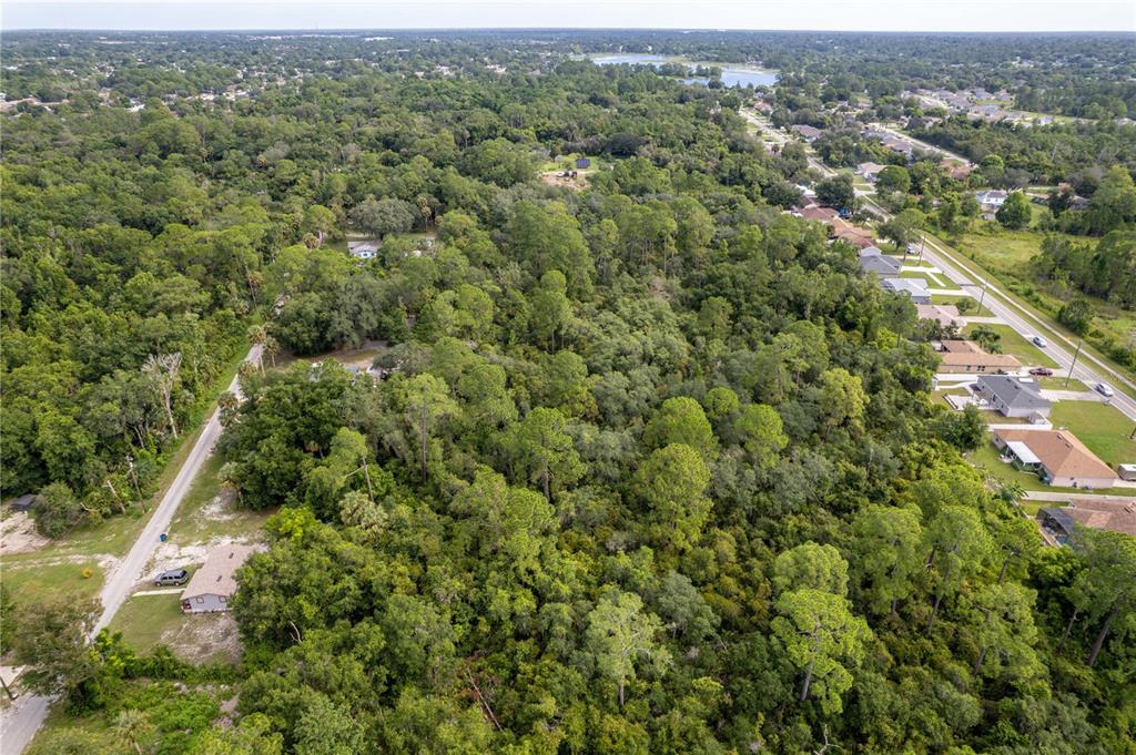 North Road Deltona, FL 32725 - Photo 3 of 13 an aerial view of residential houses with outdoor space and trees