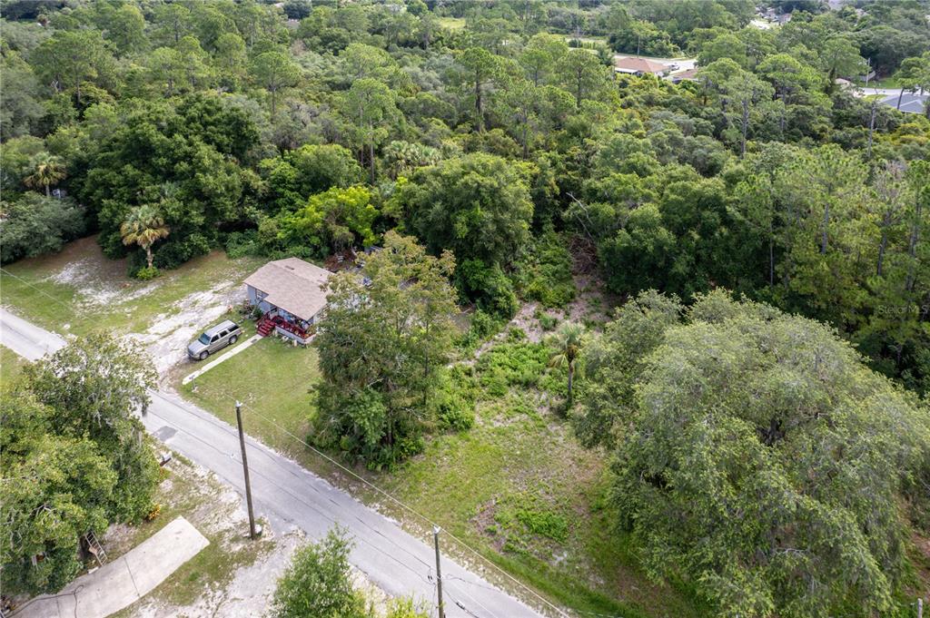 North Road Deltona, FL 32725 - Photo 4 of 13 an aerial view of residential house with outdoor space and trees all around