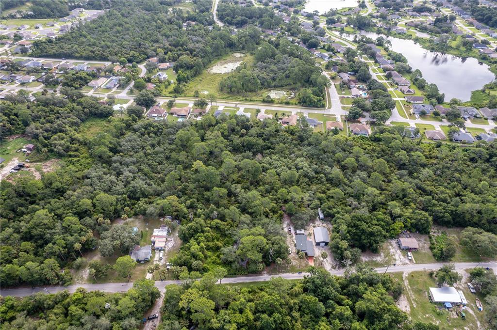 North Road Deltona, FL 32725 - Photo 7 of 13 an aerial view of residential houses with outdoor space and trees