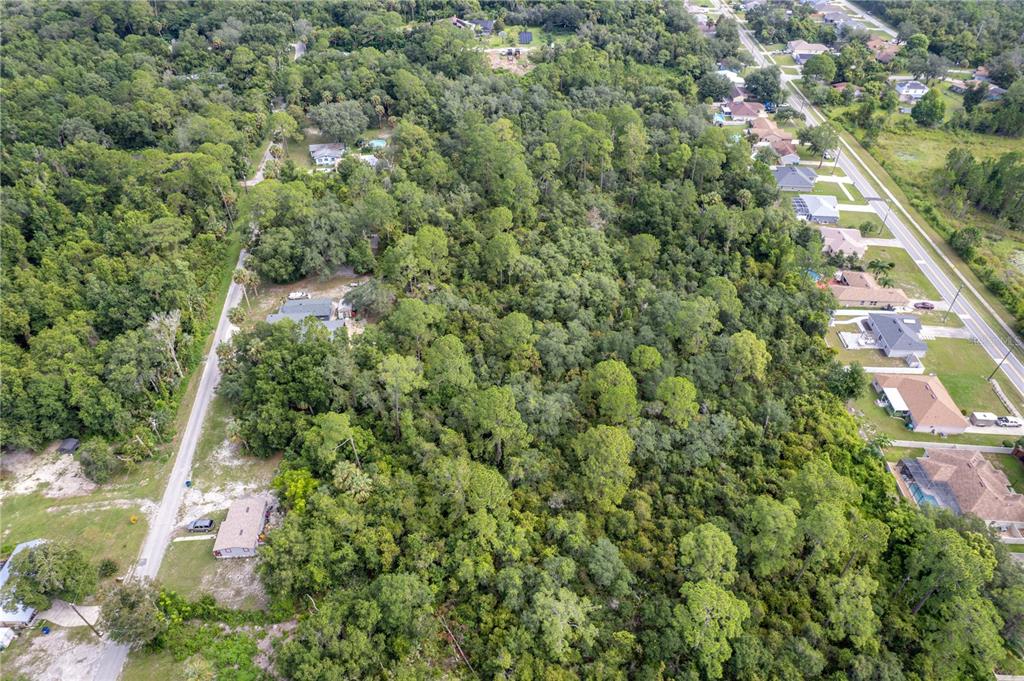 North Road Deltona, FL 32725 - Photo 8 of 13 an aerial view of a house with a yard and outdoor seating