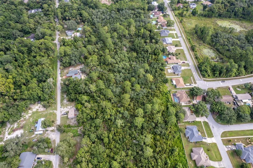 North Road Deltona, FL 32725 - Photo 10 of 13 an aerial view of residential house with outdoor space and trees all around