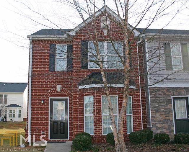1835 Grove Way Hampton, GA 30228 - Photo 1 of 1 a front view of a house with garden