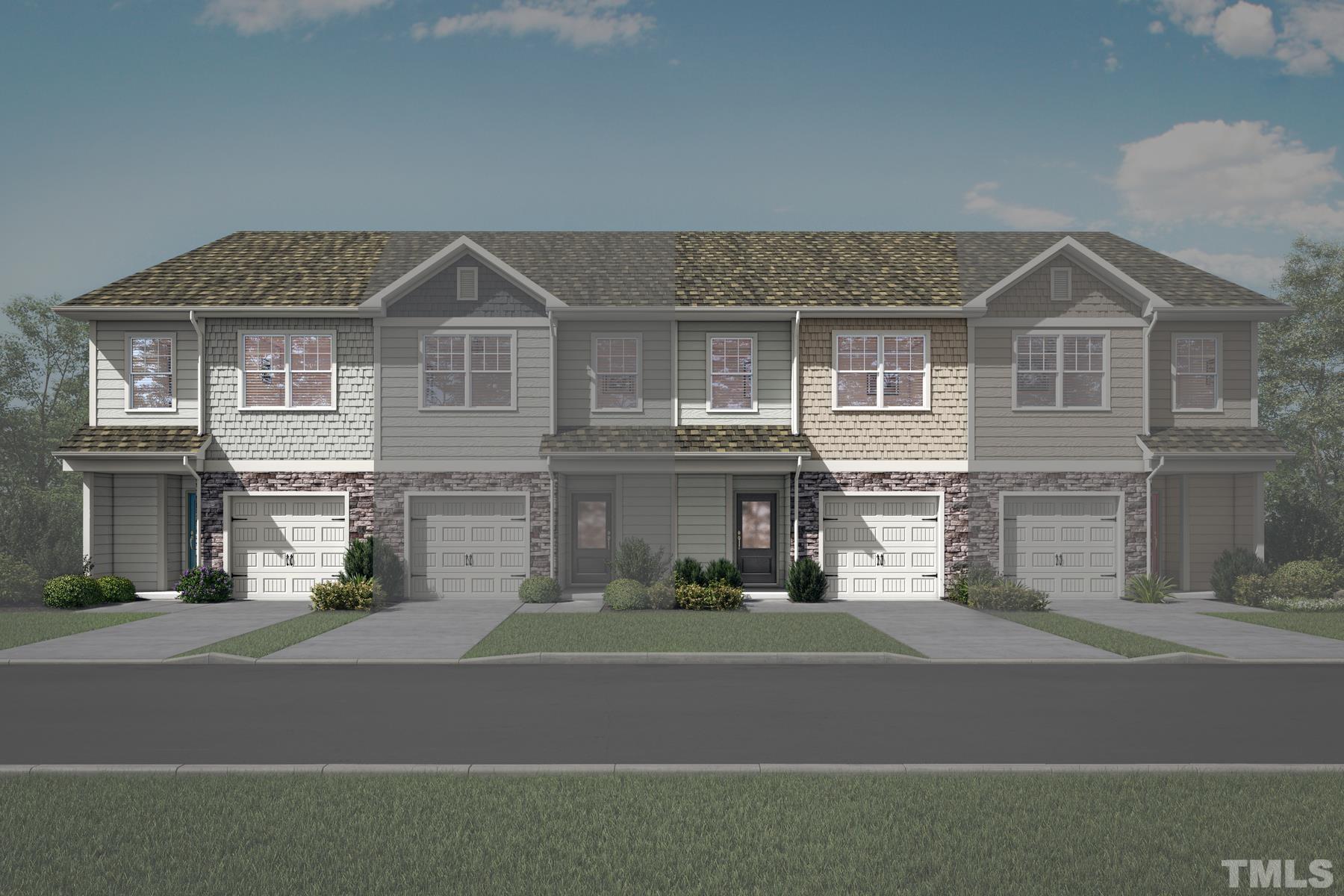 6926 Outfall Point Lane Raleigh, NC 27616 - Photo 1 of 3 a front view of a house with a yard