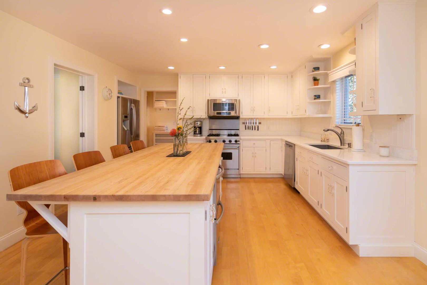 63 Norton Orchard Road Edgartown, MA 02539 - Photo 11 of 43 a large kitchen with kitchen island a sink a stove and a refrigerator