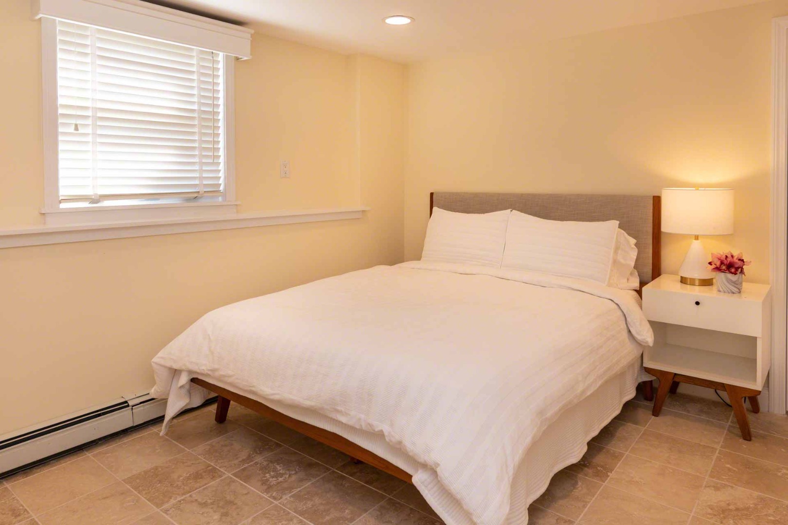 63 Norton Orchard Road Edgartown, MA 02539 - Photo 21 of 43 a large bed sitting in a bedroom next to a window