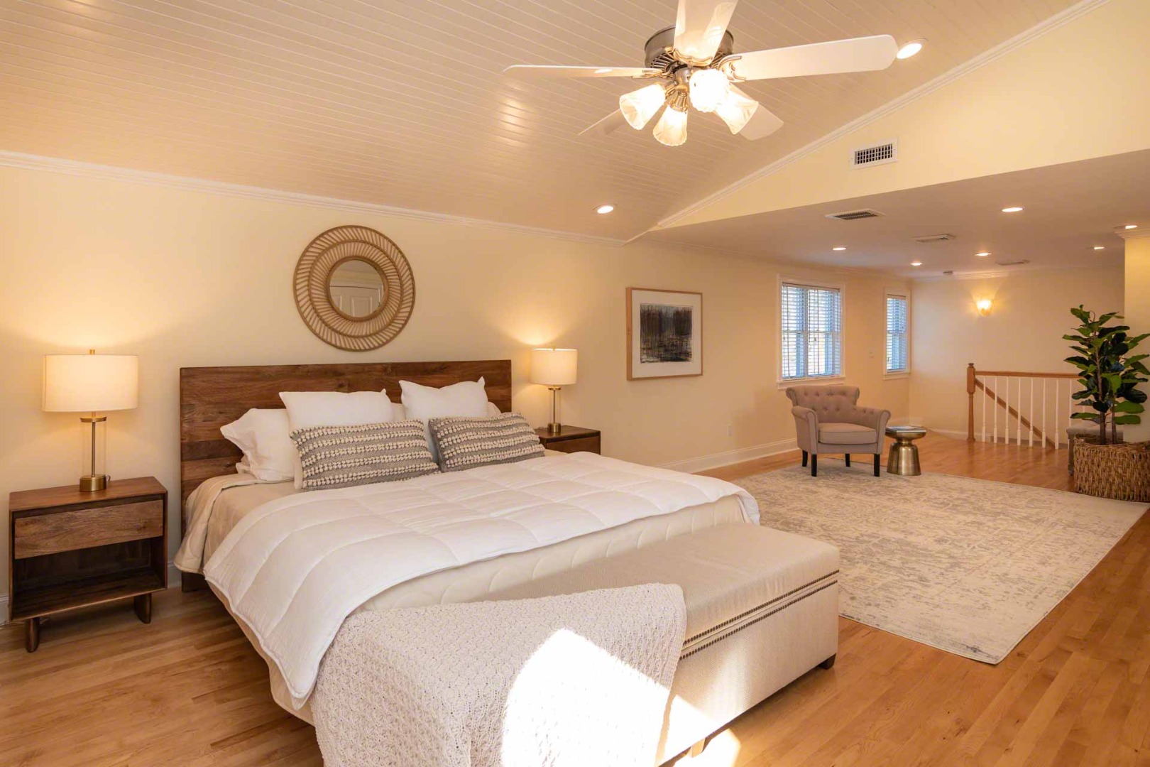 63 Norton Orchard Road Edgartown, MA 02539 - Photo 25 of 43 a large bedroom with a bed and a chandelier