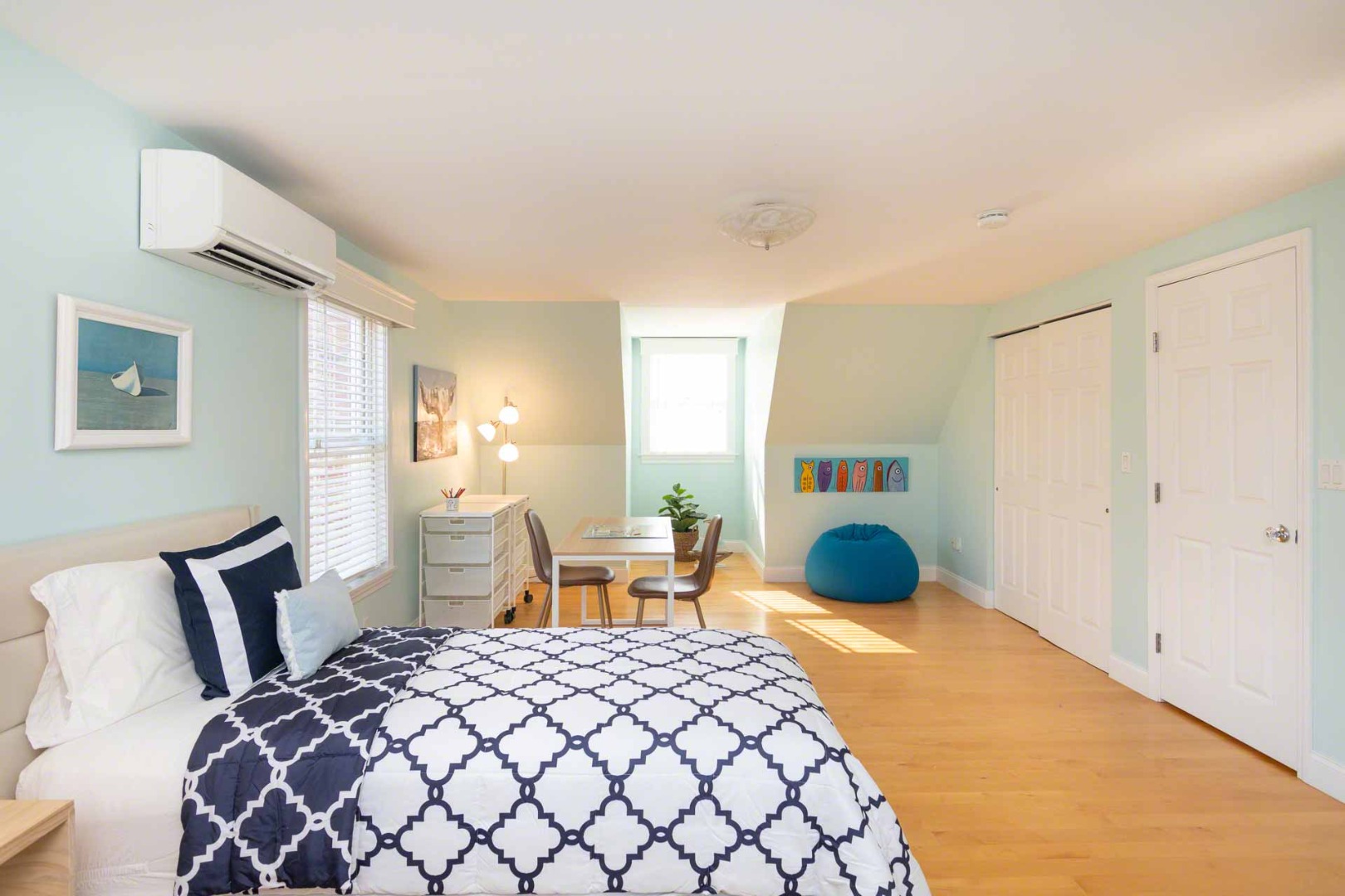 63 Norton Orchard Road Edgartown, MA 02539 - Photo 30 of 43 a bedroom with a bed a table and chair