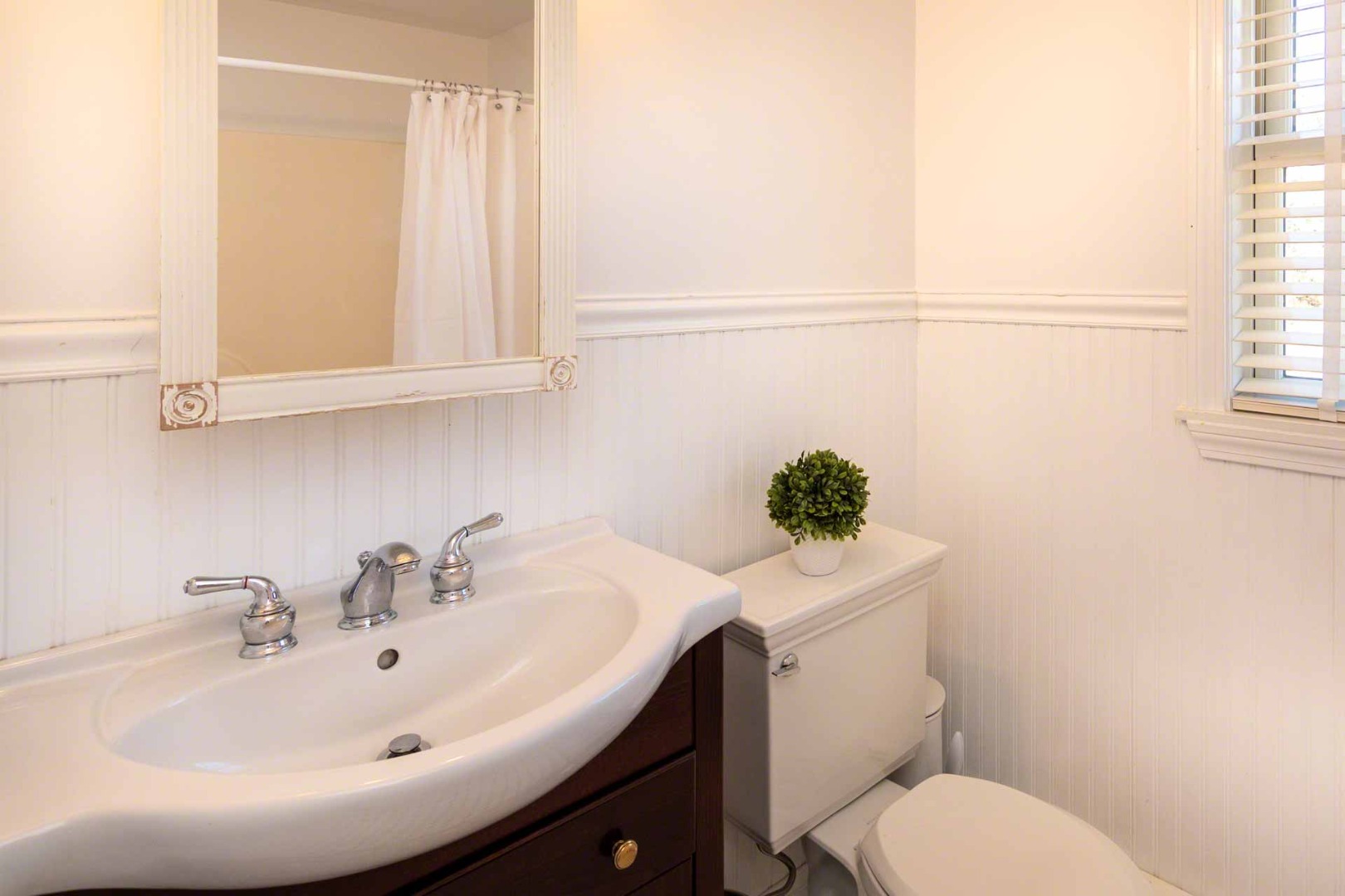 63 Norton Orchard Road Edgartown, MA 02539 - Photo 33 of 43 a bathroom with a sink a toilet and mirror