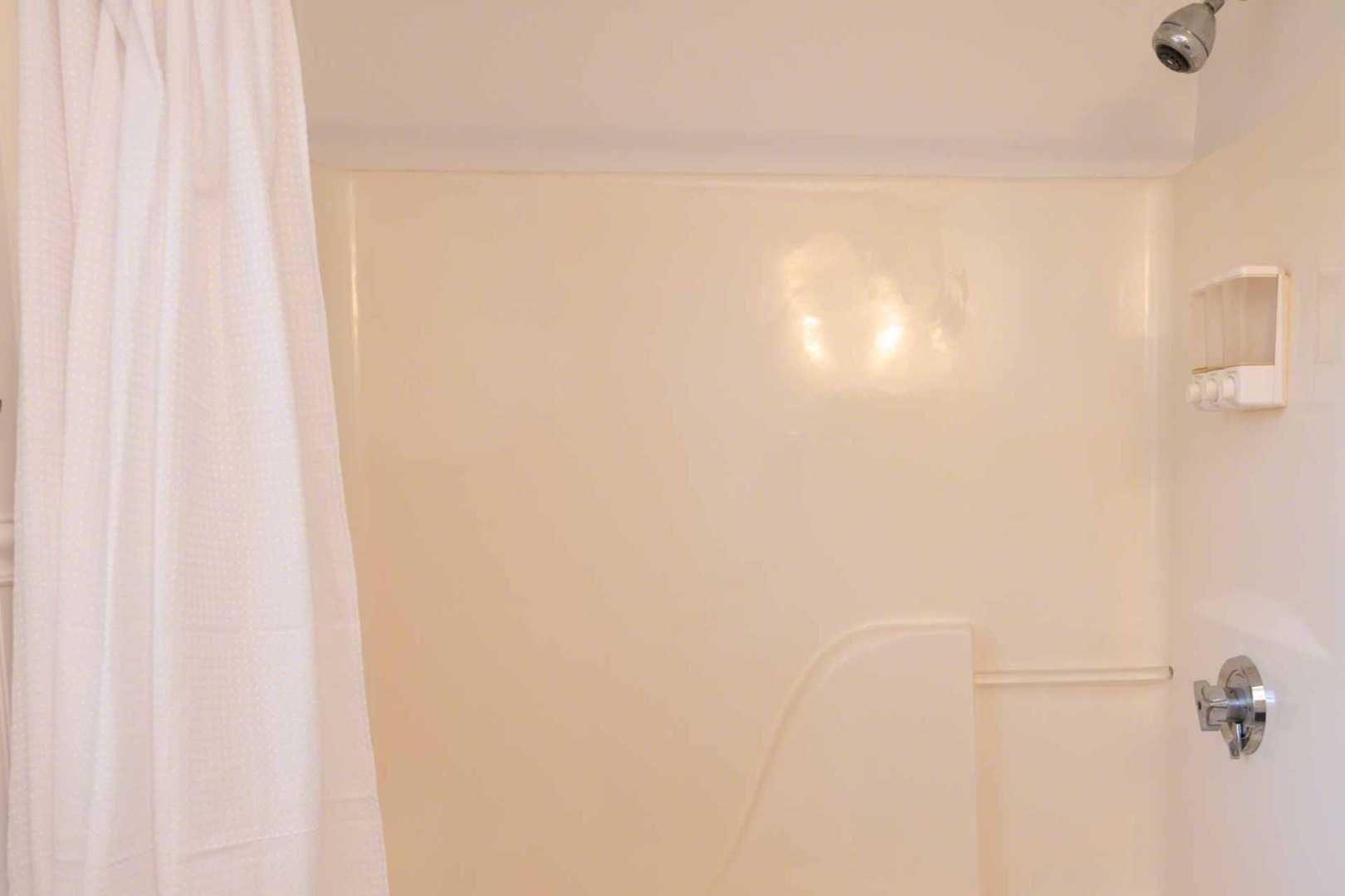 63 Norton Orchard Road Edgartown, MA 02539 - Photo 34 of 43 a bathroom with a shower curtain