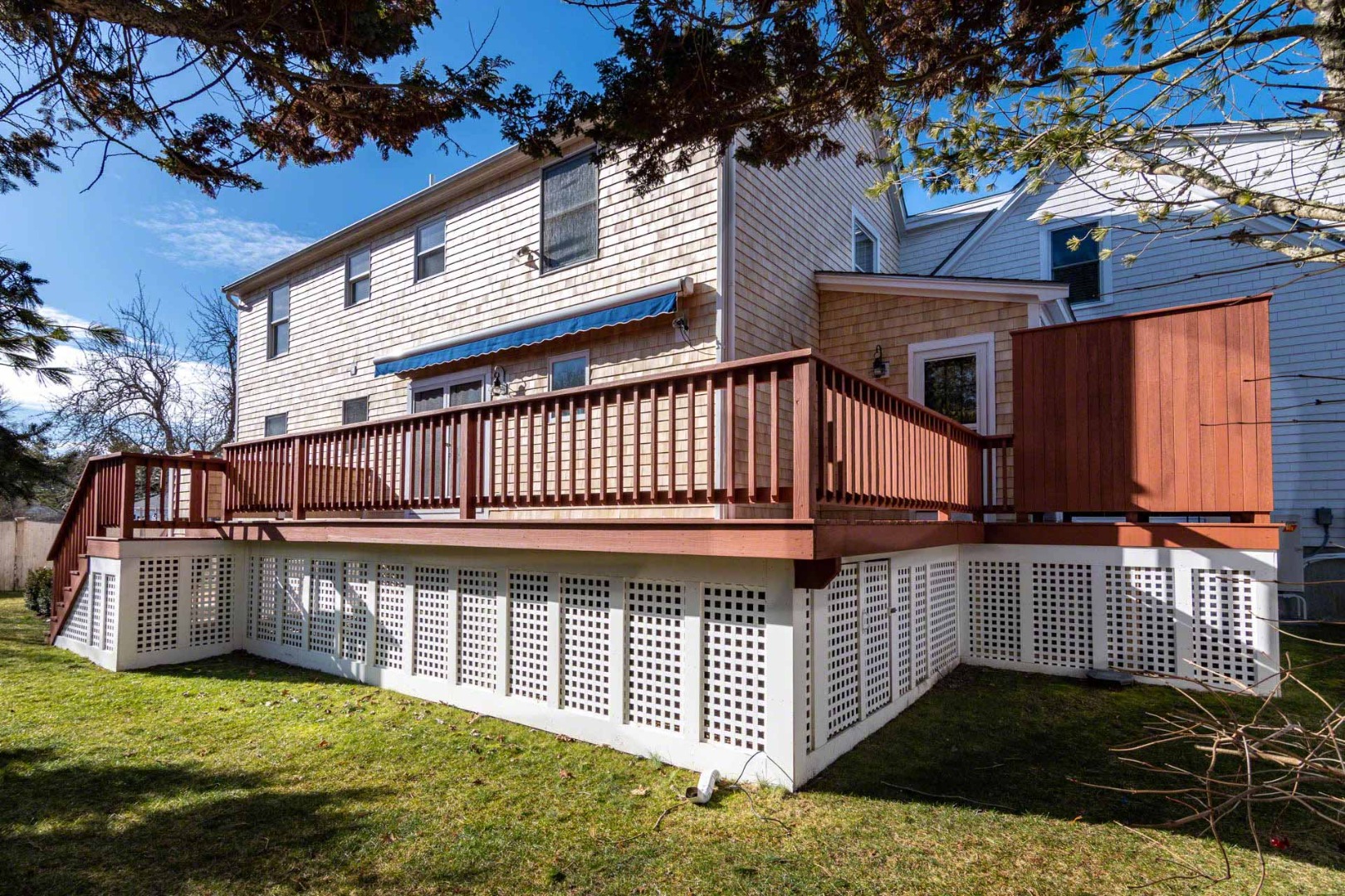 63 Norton Orchard Road Edgartown, MA 02539 - Photo 39 of 43 a view of a house with a wooden deck