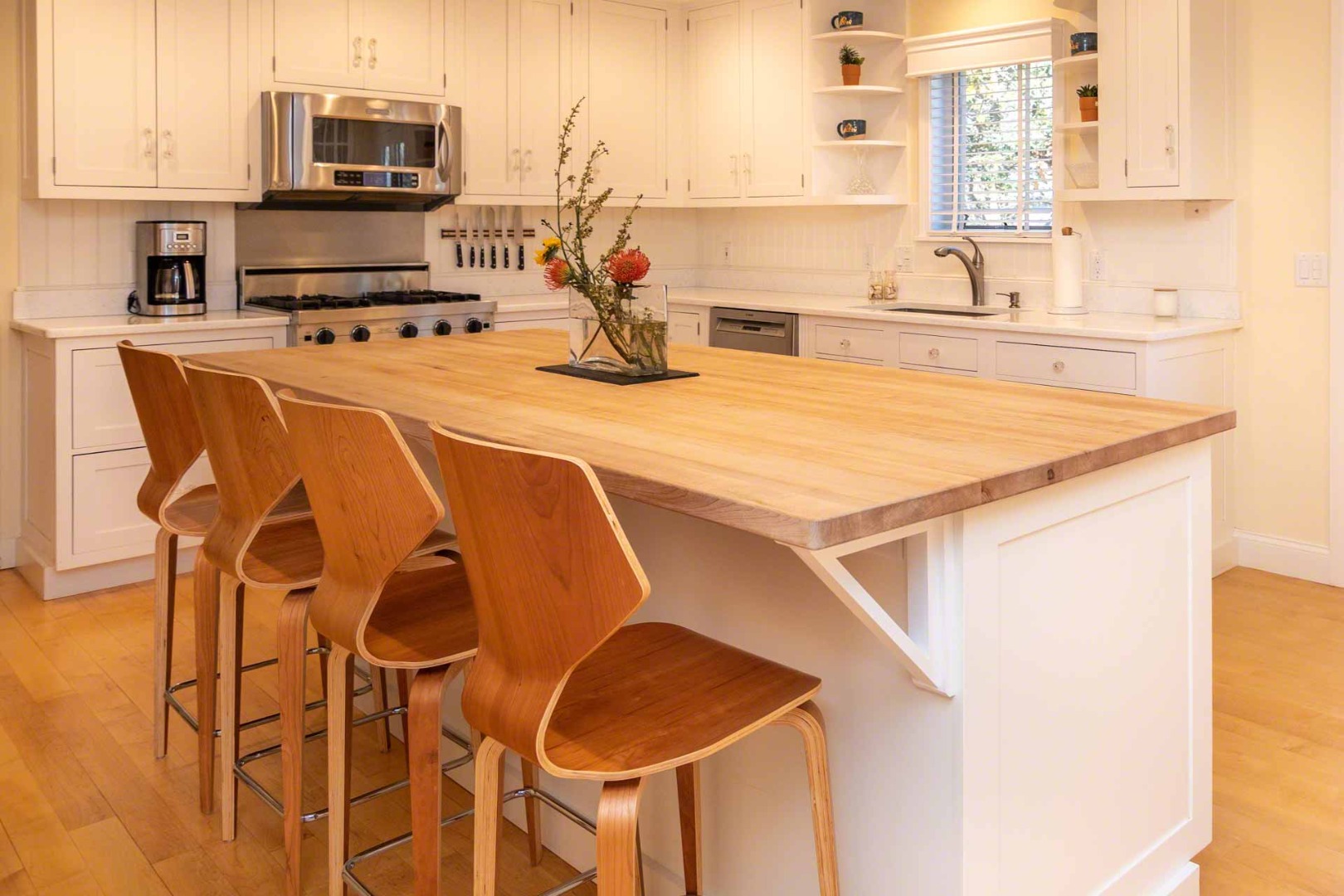 63 Norton Orchard Road Edgartown, MA 02539 - Photo 9 of 43 a kitchen with a stove a sink and a microwave