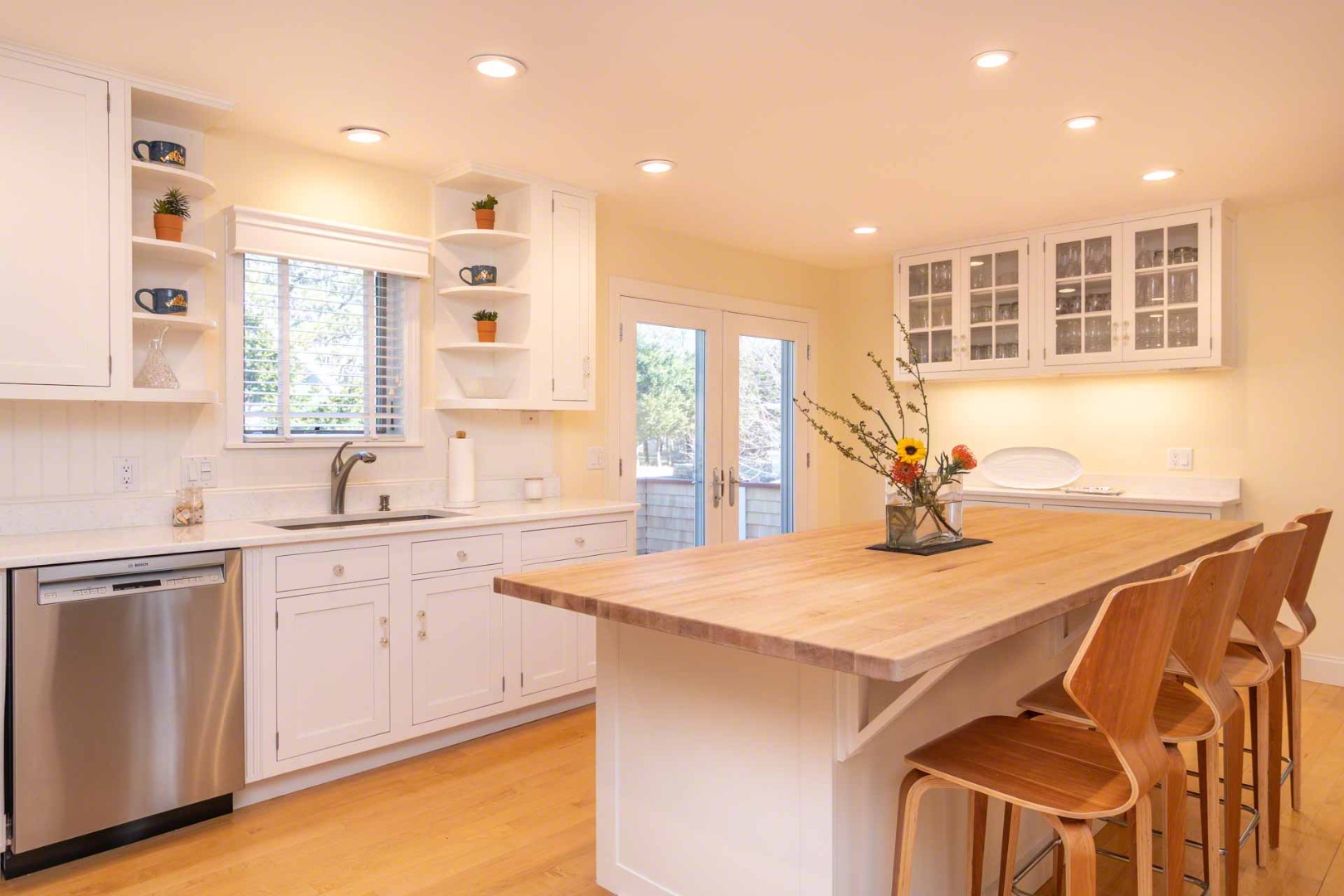 63 Norton Orchard Road Edgartown, MA 02539 - Photo 10 of 43 a kitchen with a sink a stove and cabinets