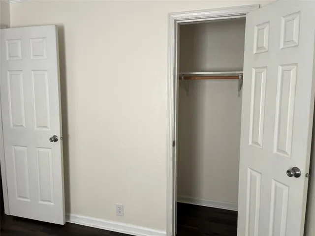 a view of walk in closet with rug