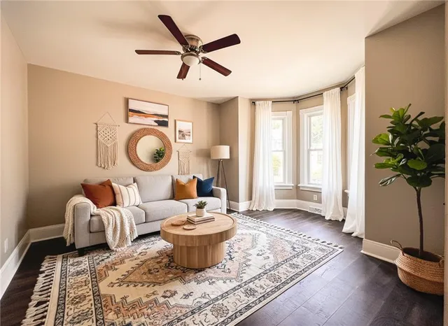 a living room with patio furniture and a window