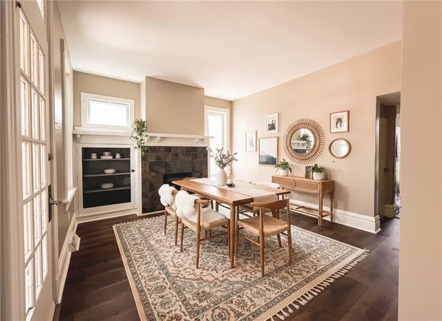 a dining room with a table and chairs