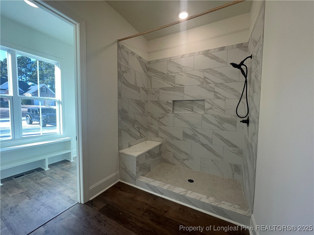 484 Falling Water Road Spring Lake, NC 28390 - Photo 11 of 18 a bathroom with a glass shower door