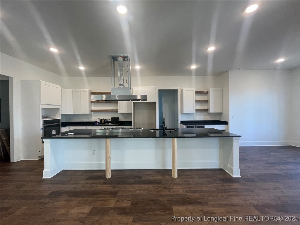 484 Falling Water Road Spring Lake, NC 28390 - Photo 3 of 18 a kitchen with stainless steel appliances a sink and a stove top oven