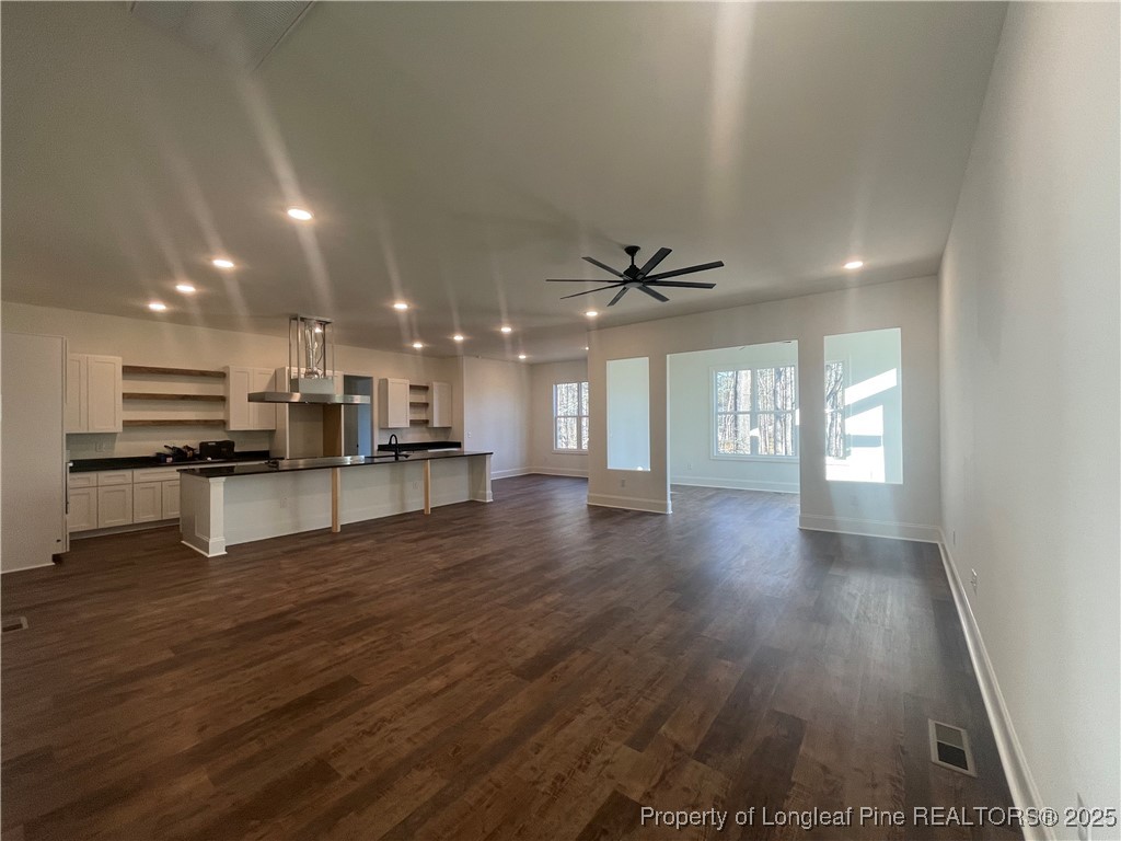 484 Falling Water Road Spring Lake, NC 28390 - Photo 6 of 18 a view of kitchen with cabinets and wooden floor