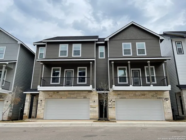 a front view of a house with a garage