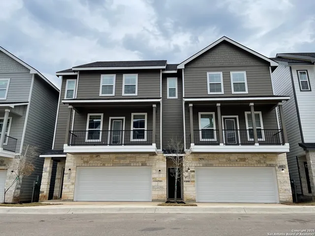 a front view of a house with a garage