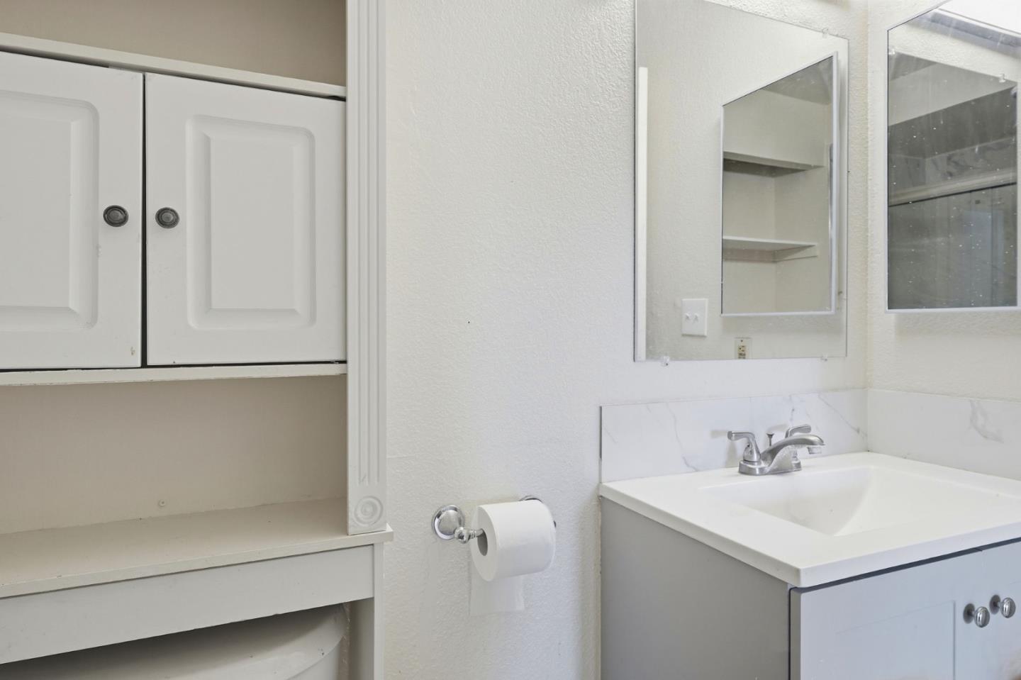 7283 Florin Road, Unit 8 Sacramento, CA 95828 - Photo 27 of 35 a bathroom with a sink and a mirror