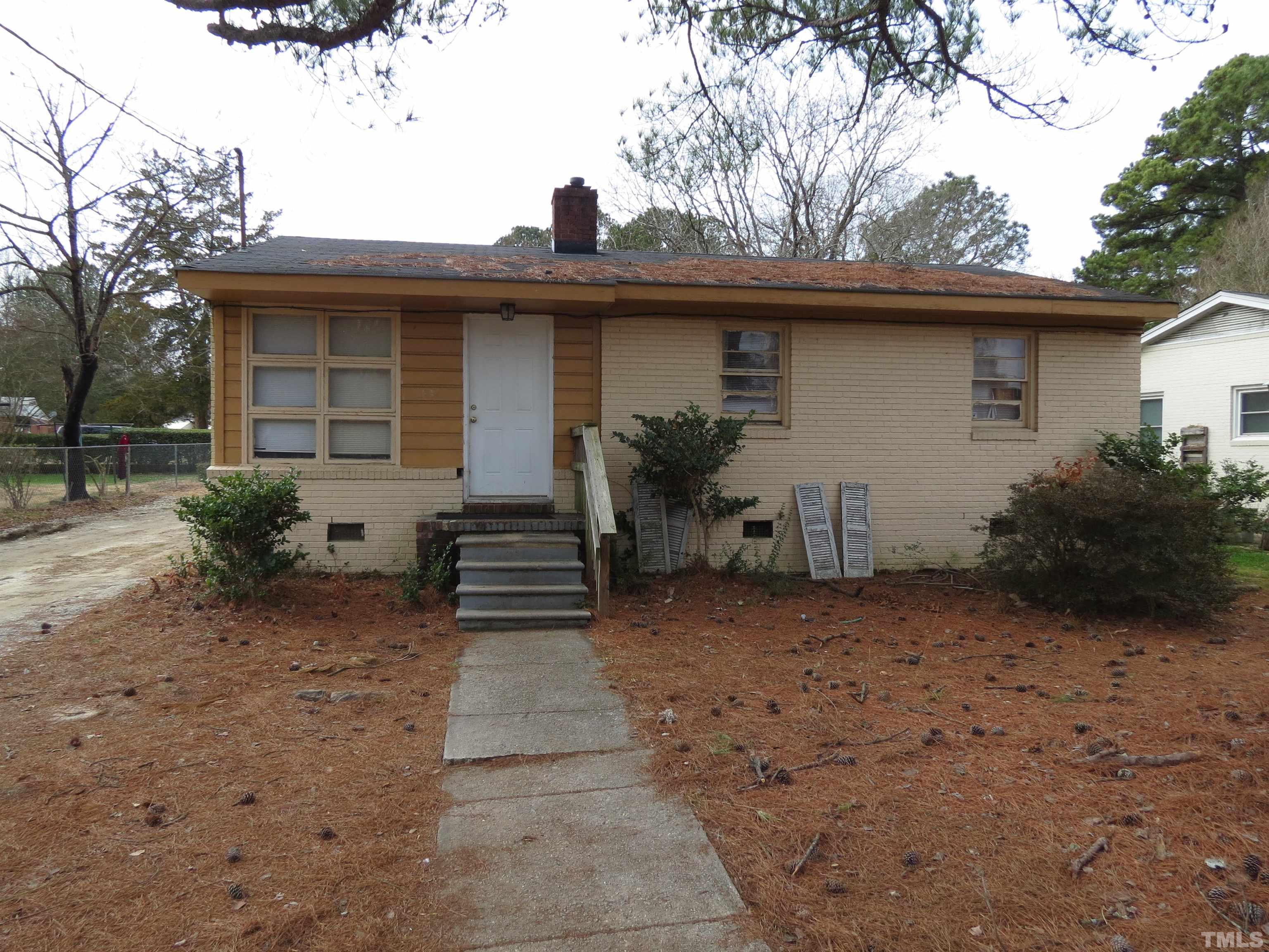 1816 Charles Street Raleigh, NC 27610 - Photo 1 of 4 a view of a house with a backyard and plants