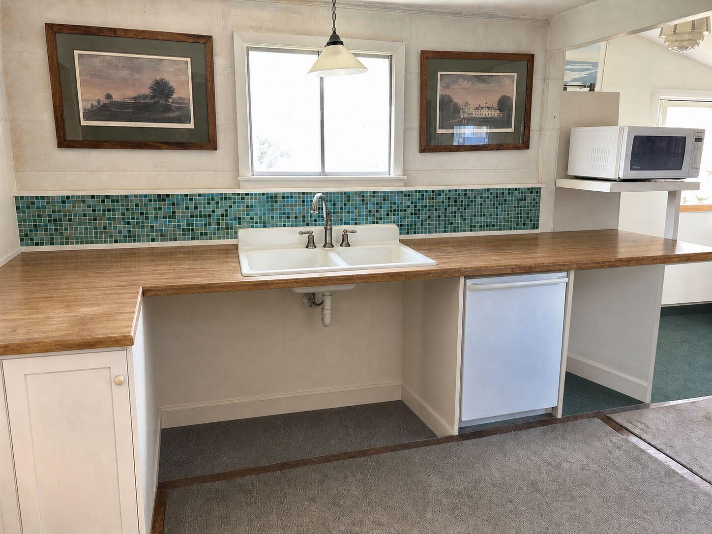 10 Benson Road Truro, MA 02666 - Photo 14 of 36 a room with cabinets and window
