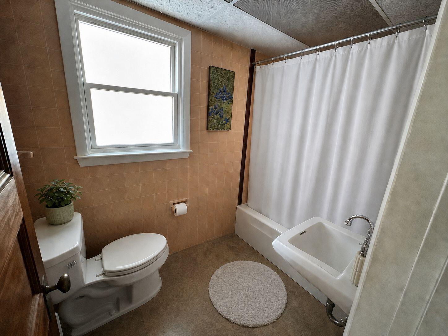 10 Benson Road Truro, MA 02666 - Photo 17 of 36 a bathroom with a toilet a sink and a mirror