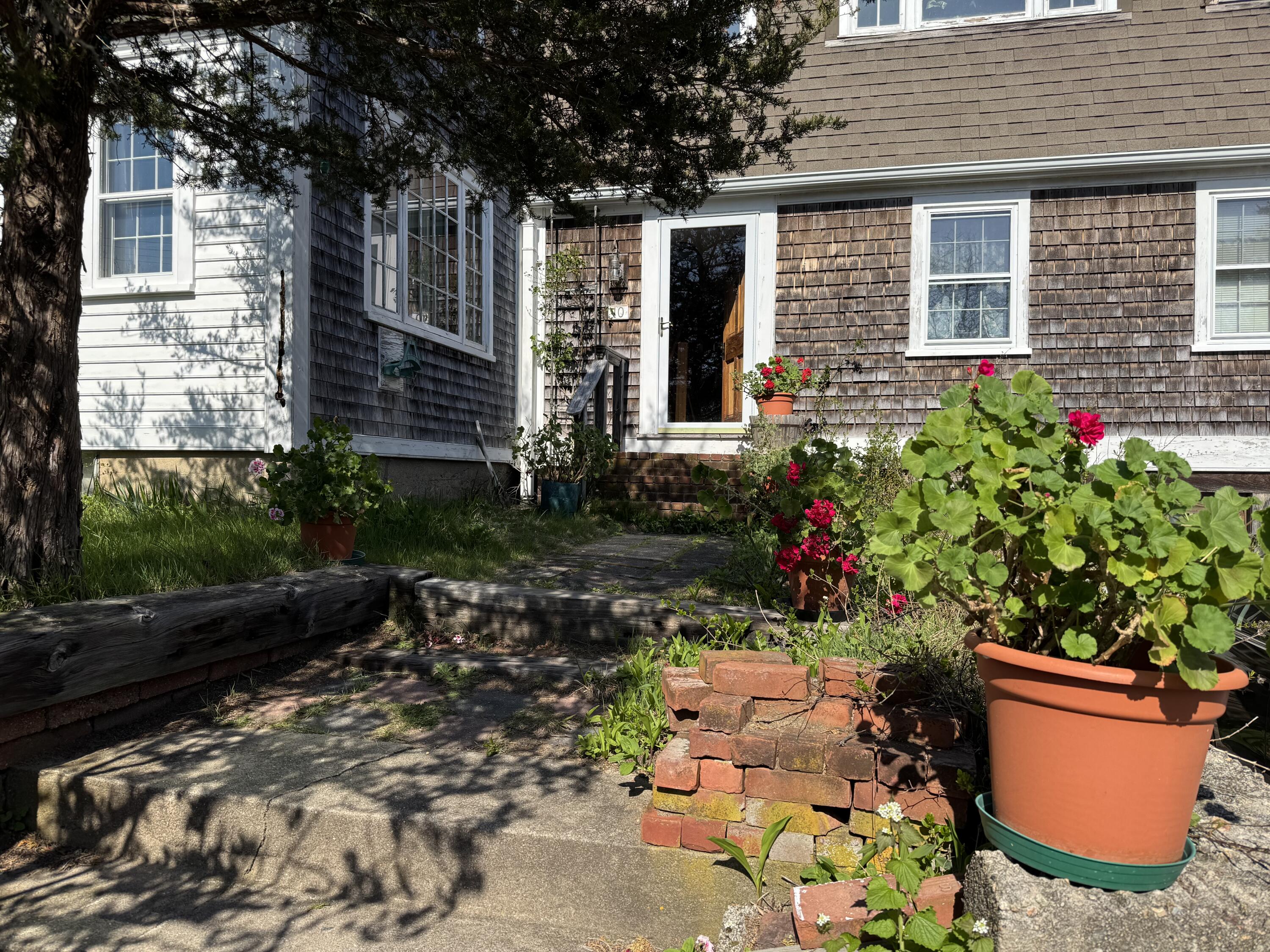 10 Benson Road Truro, MA 02666 - Photo 18 of 36 a backyard of a house with outdoor seating