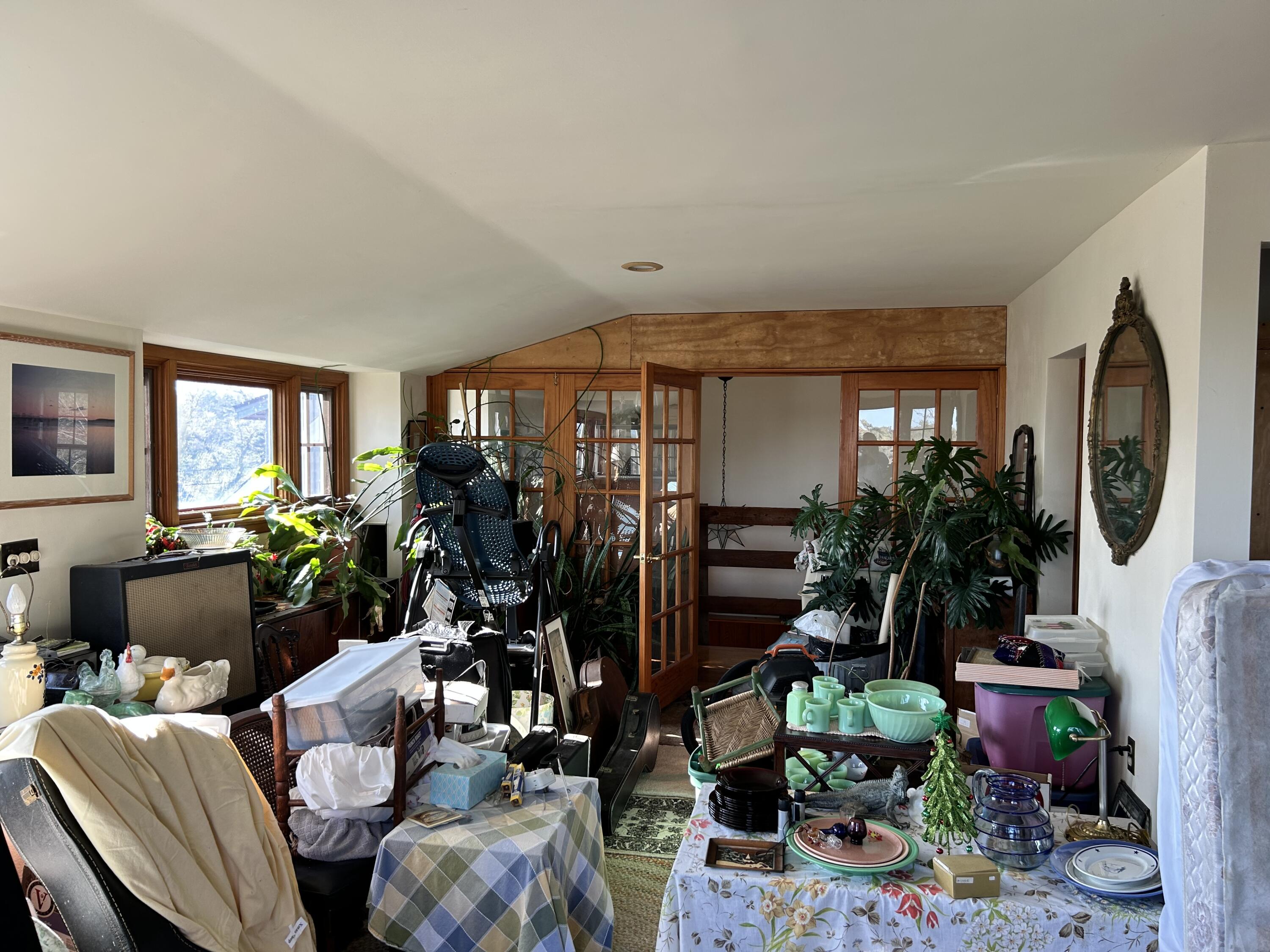 10 Benson Road Truro, MA 02666 - Photo 6 of 36 a room with furniture a potted plant and a large window