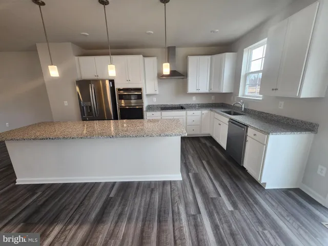 a large kitchen with cabinets