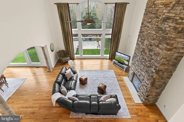a kitchen with stainless steel appliances granite countertop a stove a sink a oven a dining table and chairs
